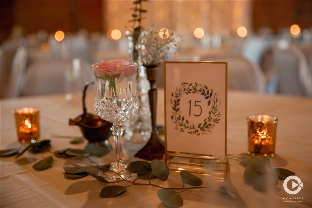 Table setting, wedding, table number, candles, greenery