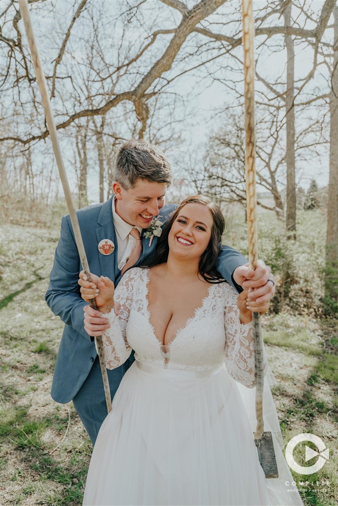 bride and groom on swing