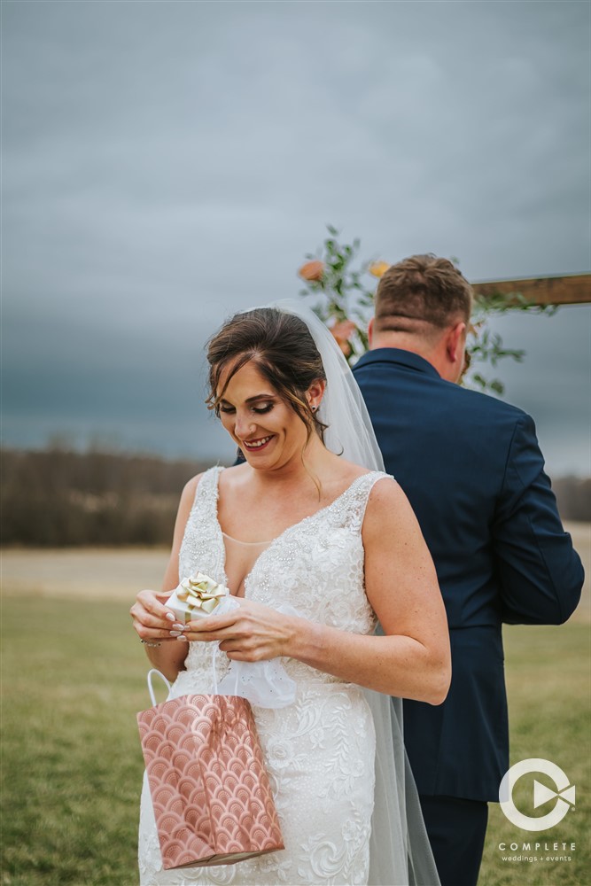 bride opening a gift before the wedding