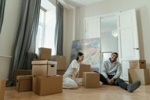 a couple with moving boxes