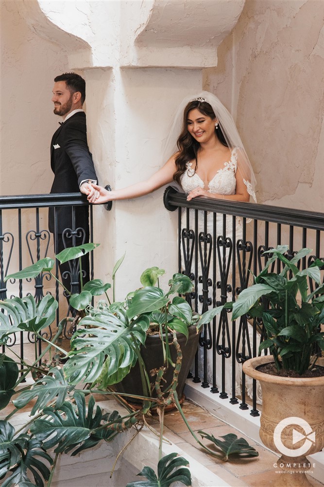 first look wedding photos on a balcony