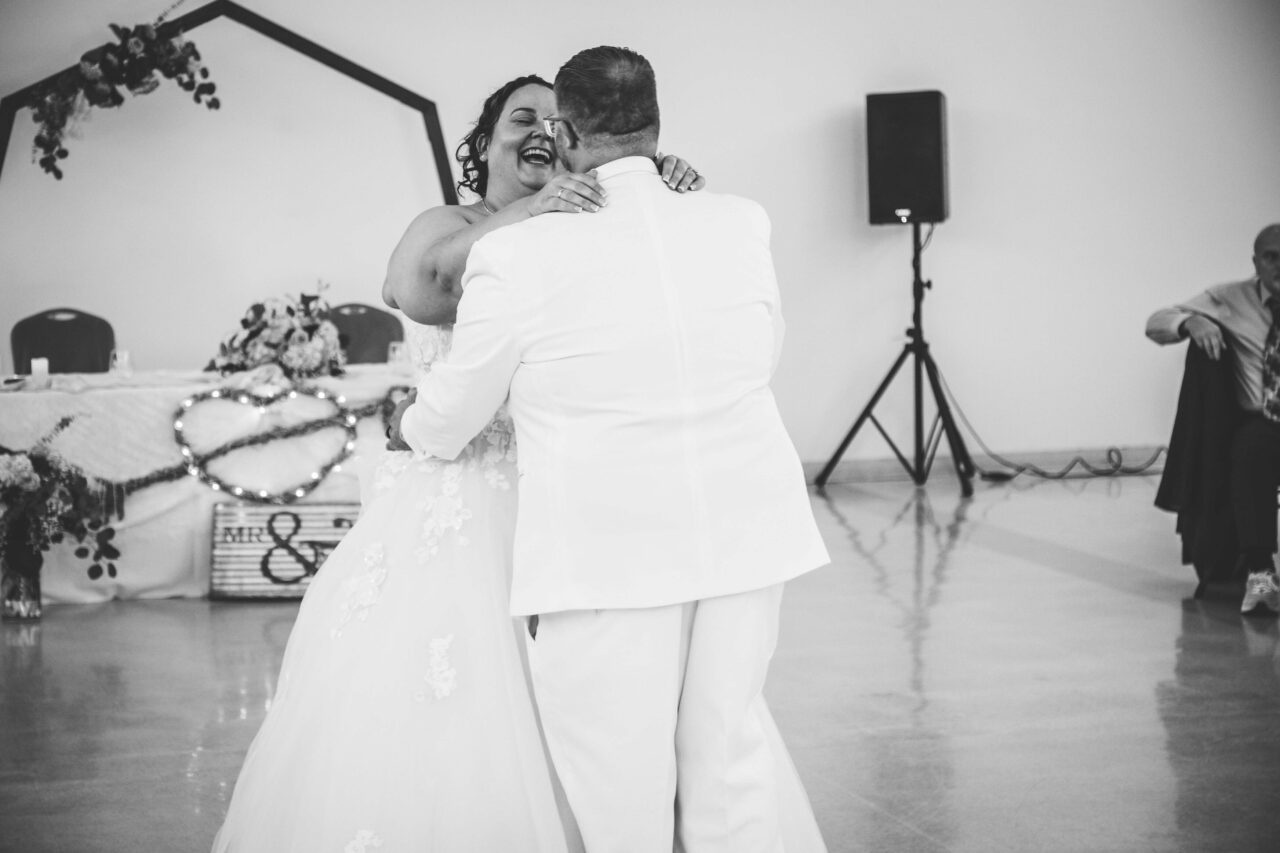 Black and White Image of Bride and Groom Dancing