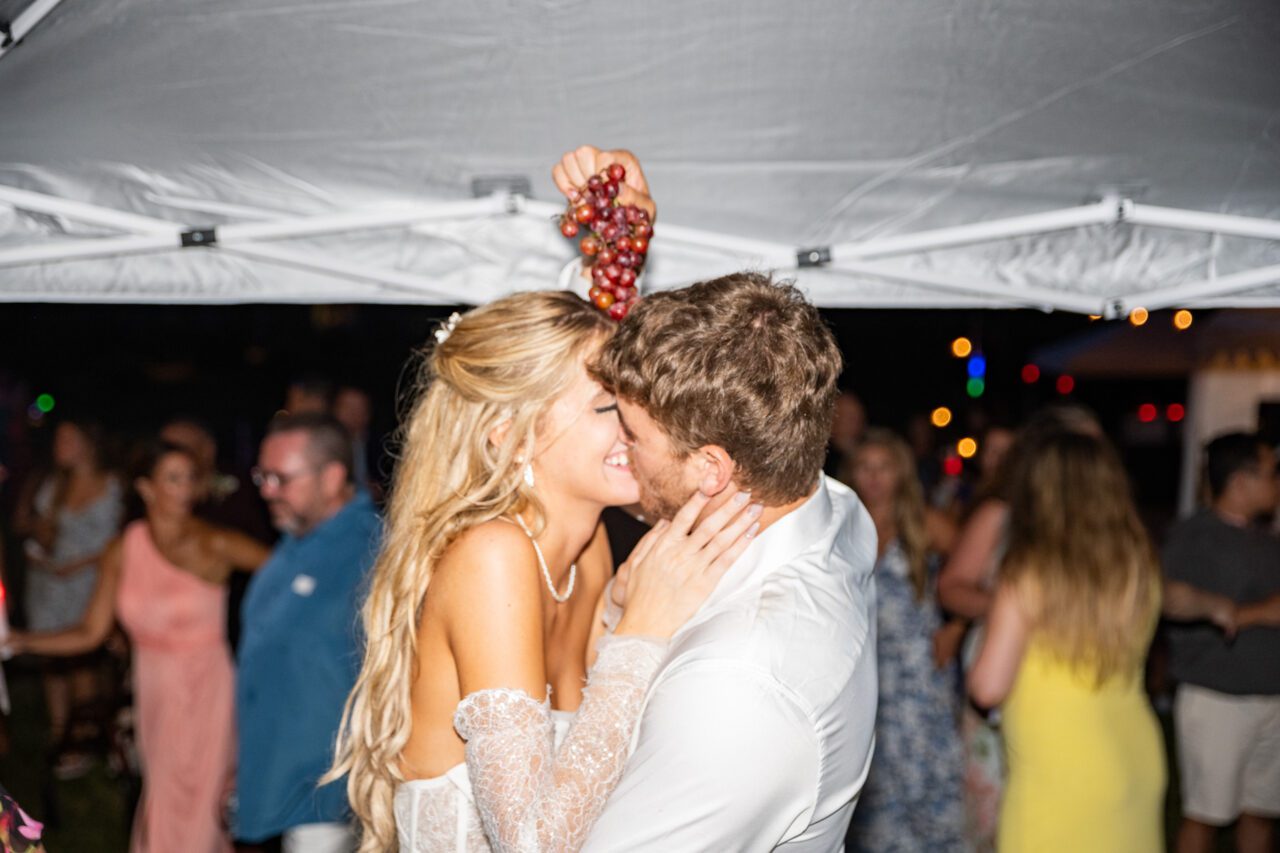 Bride and Groom Steal a Kiss