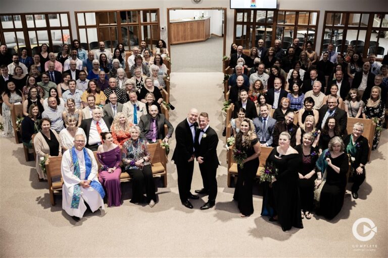 Groom and Groom with everyone at the church, group photo