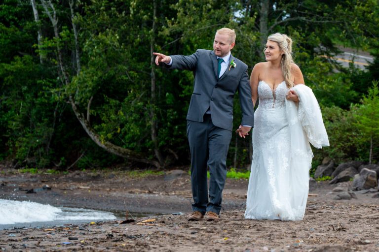 Bride and groom along Lake Superior shoreline in Black Beach,Two Harbors Minnesota