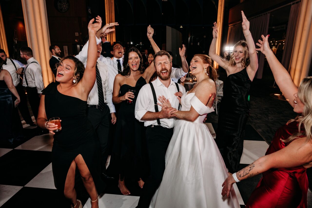 Wedding guests celebrating together and creating lifelong memories on the dance floor