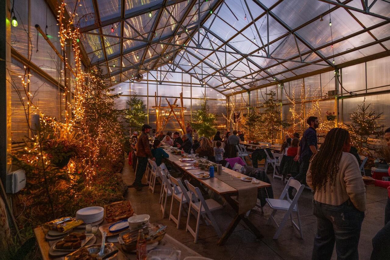celebrating inside Sitio Weddings + Events greenhouse venue near Duluth Minnesota