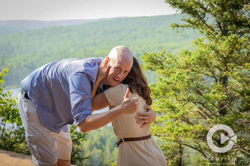 Adam giving the thumbs up while Nicole Cries after proposal