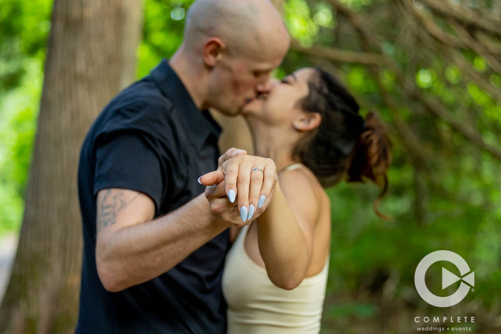 Adam and Nicole admiring engagement ring