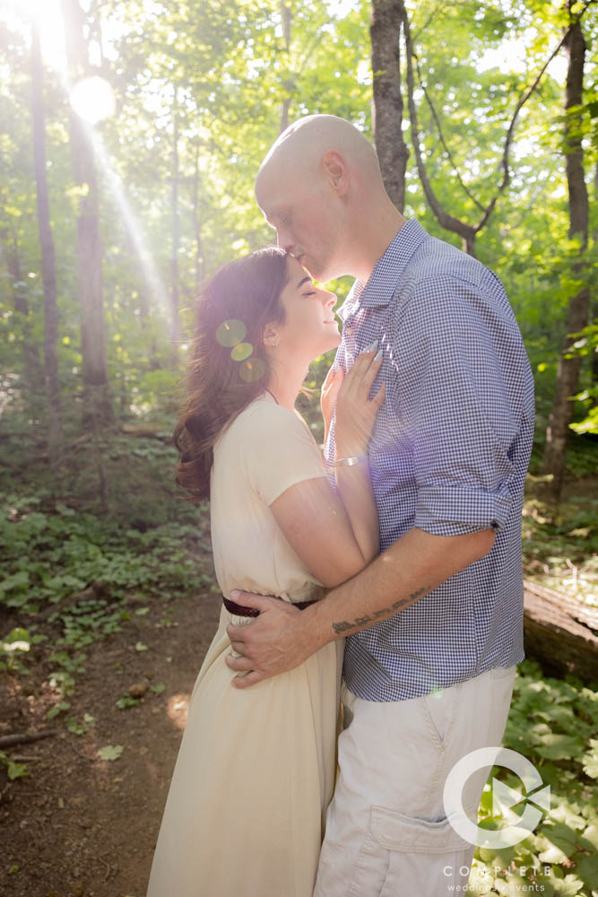 Forehead Kisses in the wood for an engagement session