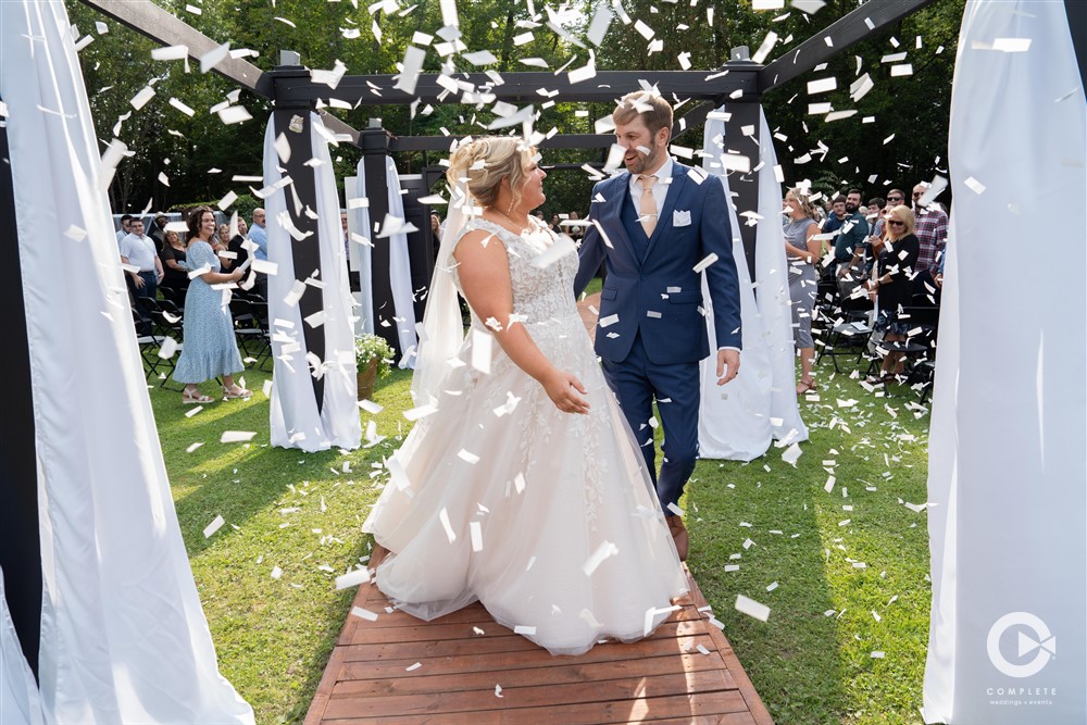 Duluth Complete Weddings and Events - Bride and Groom walking down celebrating ceremony