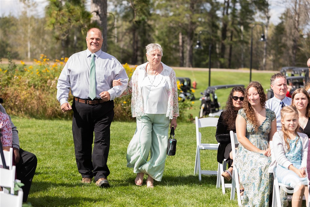 Grandparents walking down isle