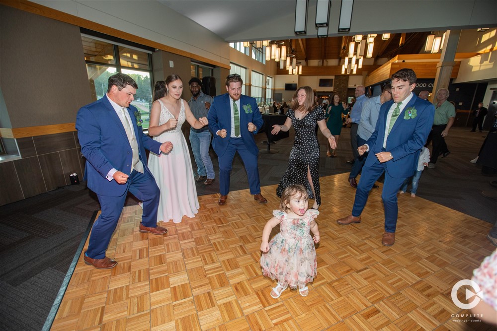 kids dancing with bride and groom