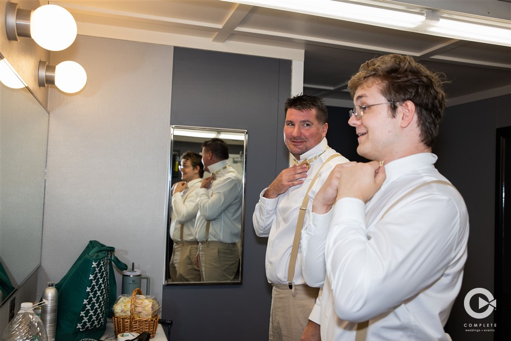 Grooms Men getting ready at MN Discovery Center