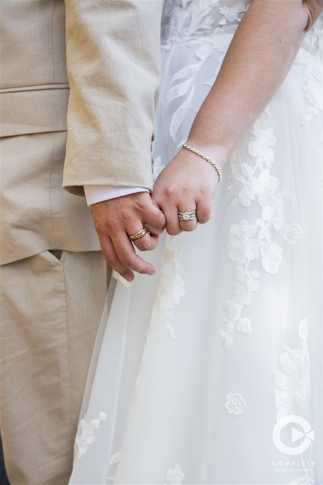 Bride and Groom Holding Hands