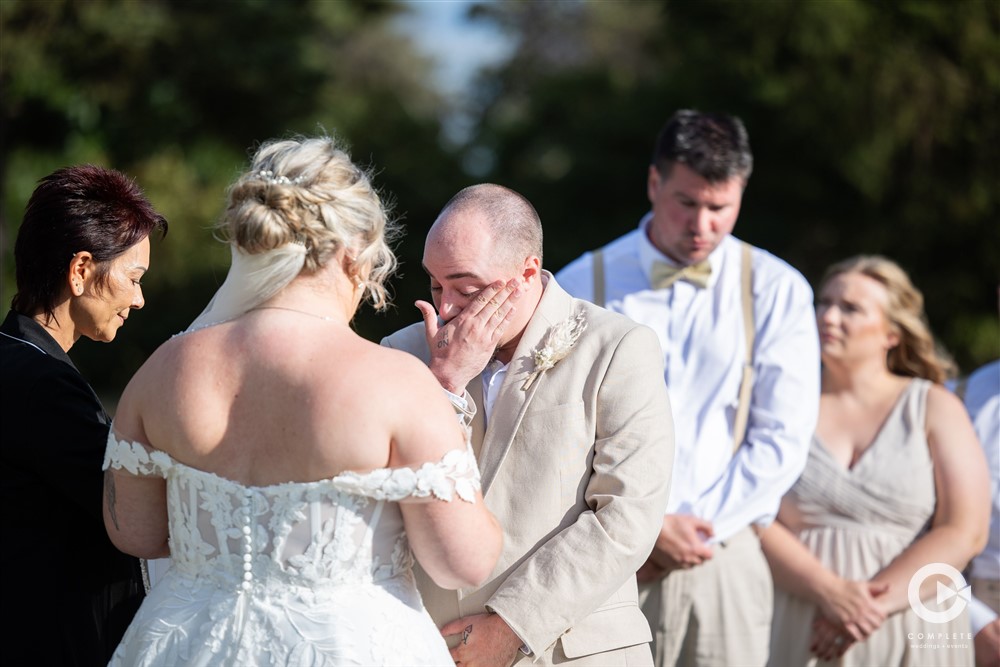 groom crying wedding ceremony - Mazy and Taylor - Complete Weddings + Events Duluth - MN Discovery Center