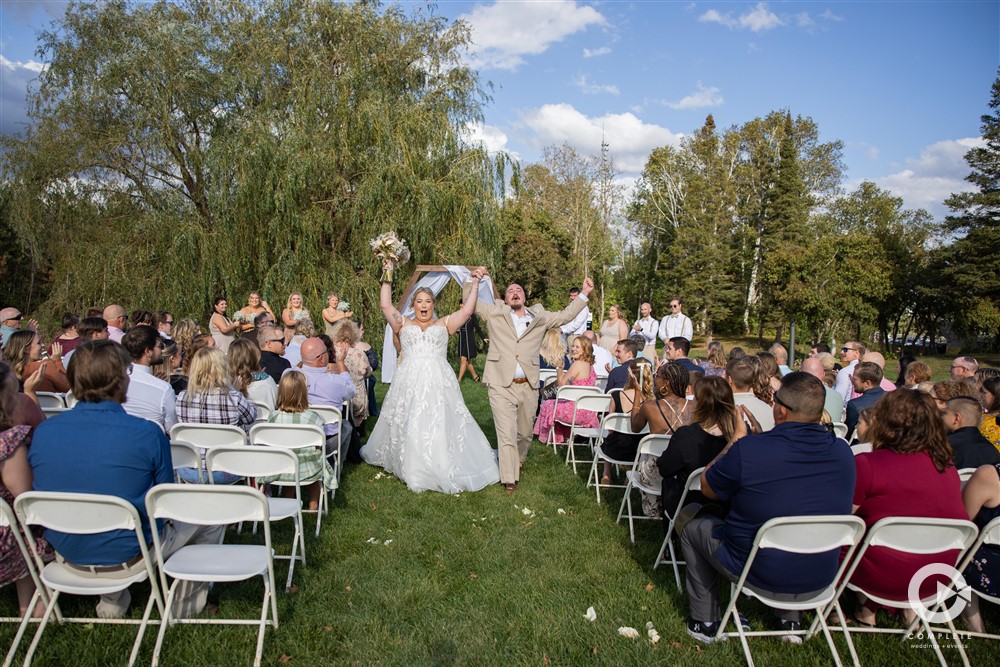 Celebrating of wedding ceremony - Complete Weddings + Events Duluth - MN Discovery Center