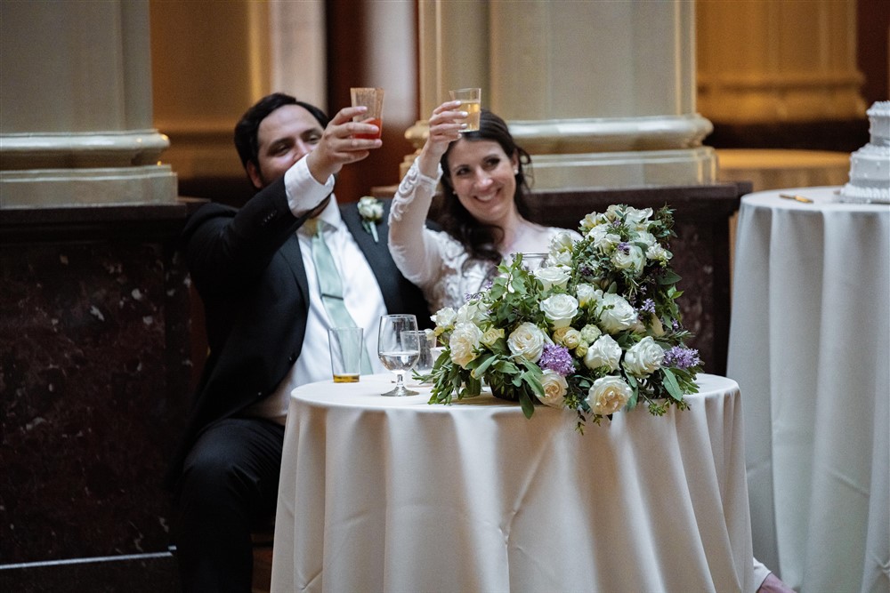 Bride and Groom raising glasses