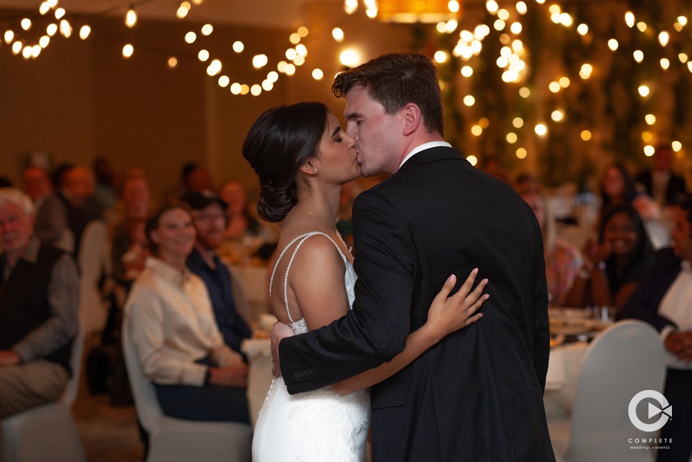 photo of bride and groom kiss photo taken by Complete Weddings + Events Duluth