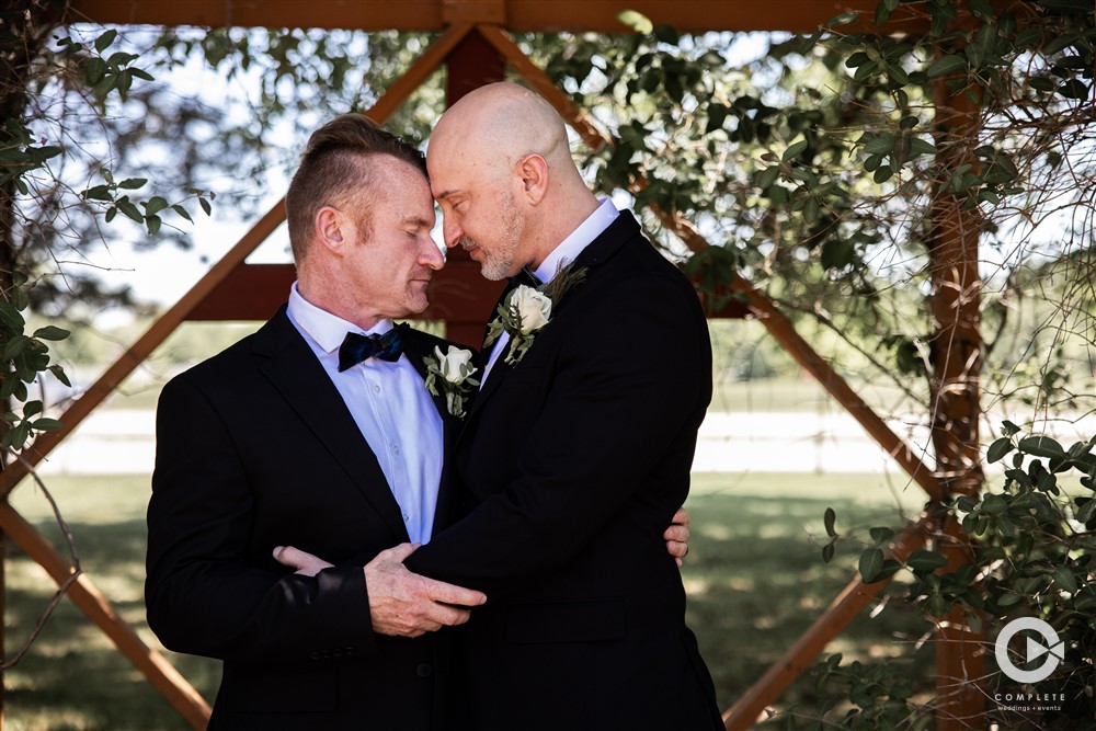 Groom and Groom with heads touching