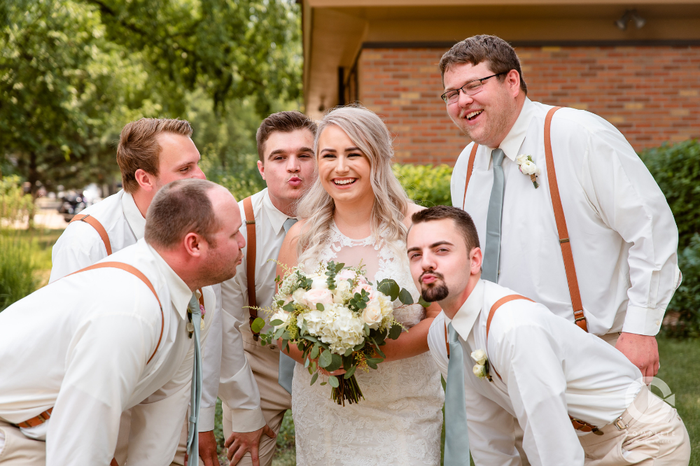 bride with groomsmen goofy