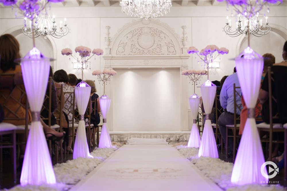 Wedding uplighting at ceremony aisle