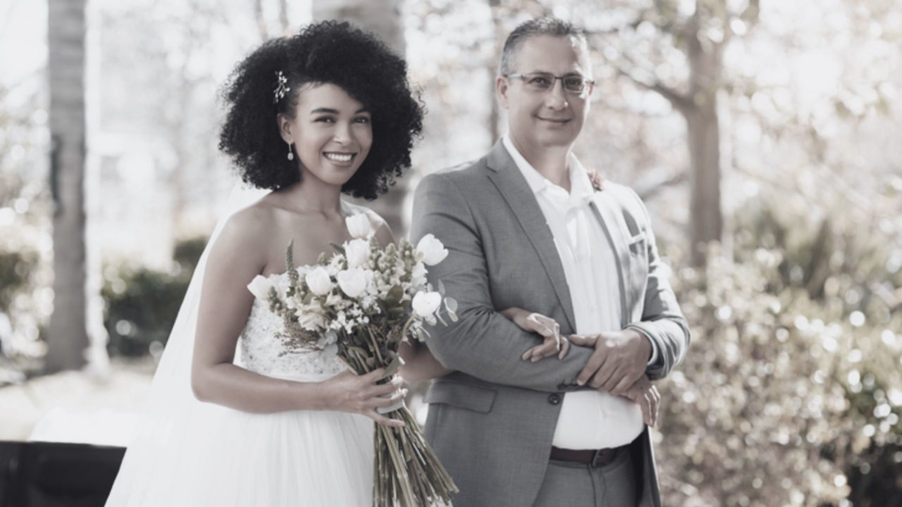 Father and bride walking down the aisle