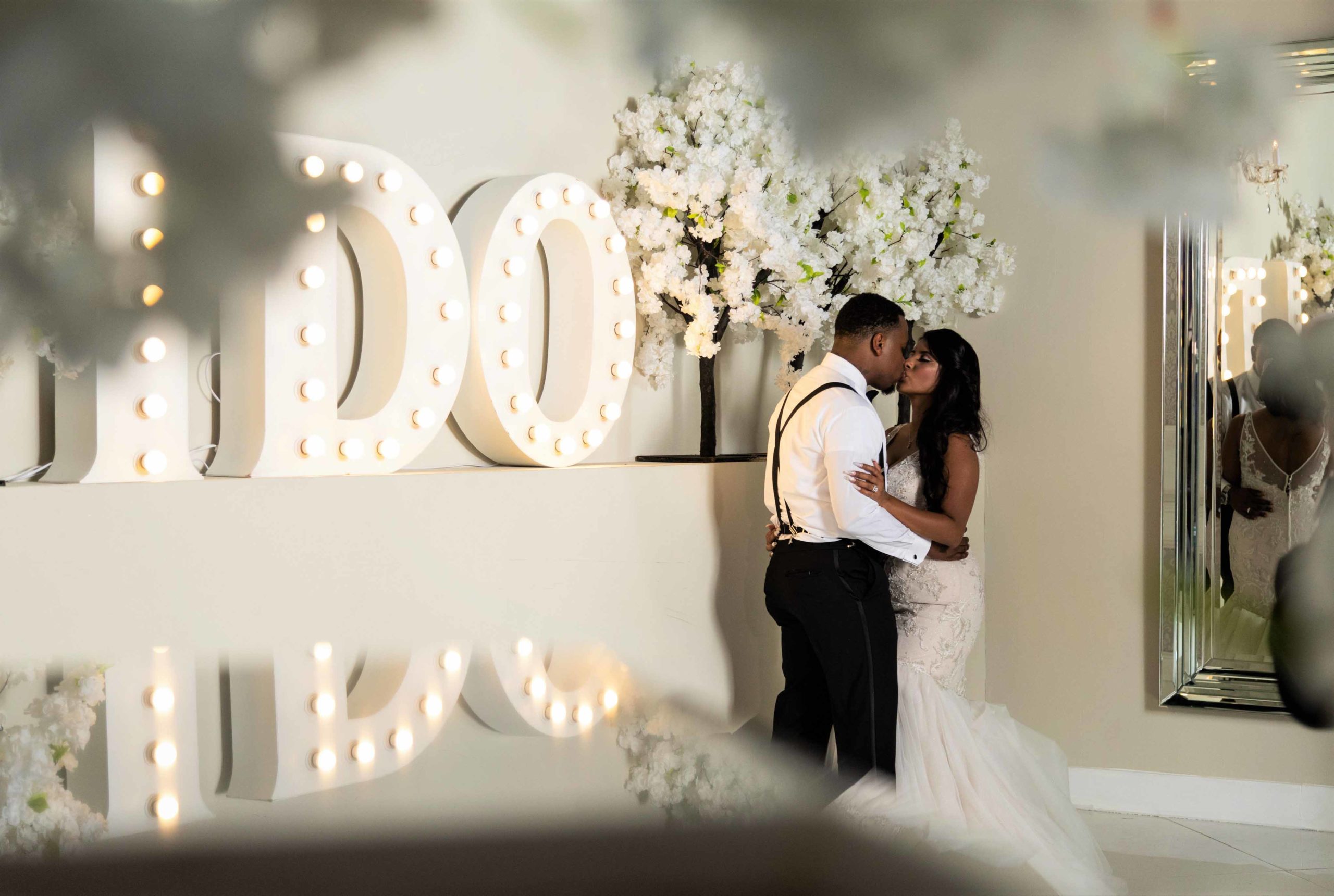 African American bride and groom kissing besid the words 