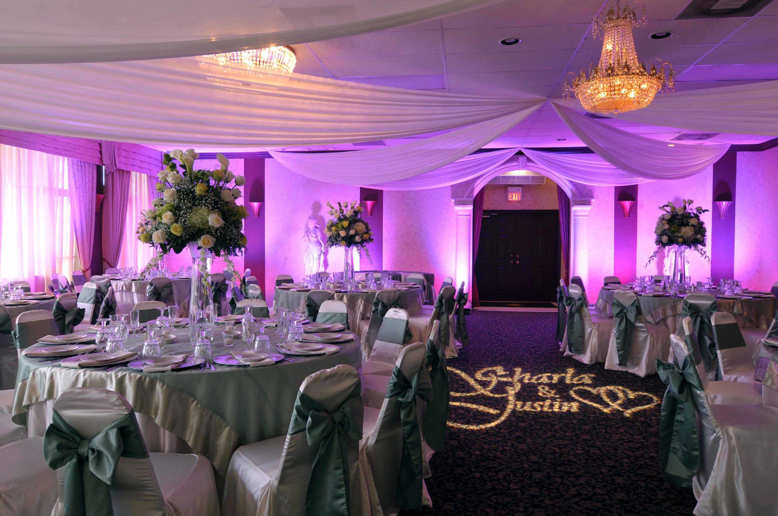 Wedding reception ballroom with lavender lighting