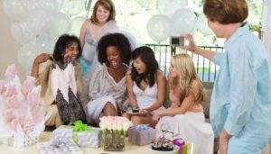 maid of honor giving gift to bride