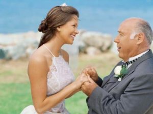 bride smiling at her father