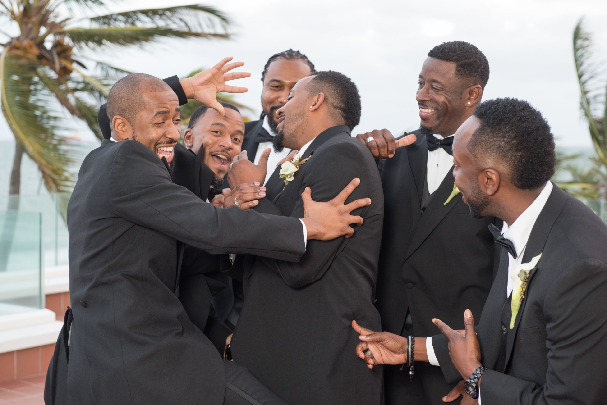 groom getting ready with groomsmen before the wedding