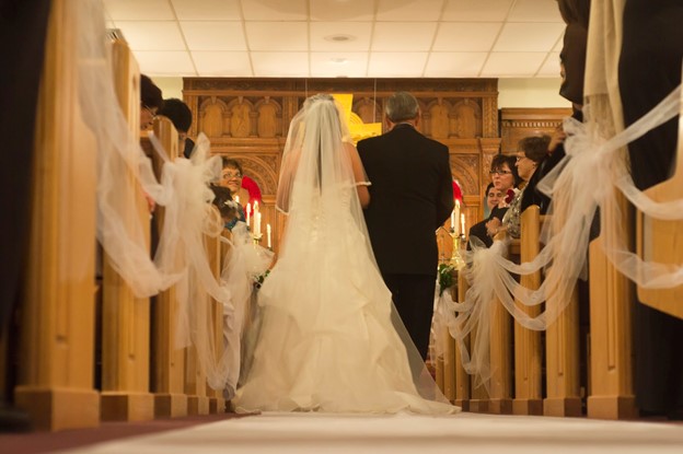 Father walking bride down aisle