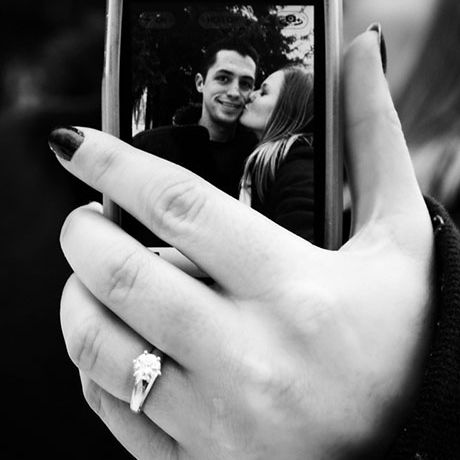 Engagement ring holding cellphone