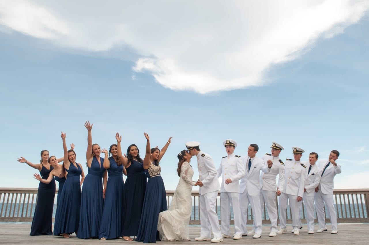 Group formals at the beach with military