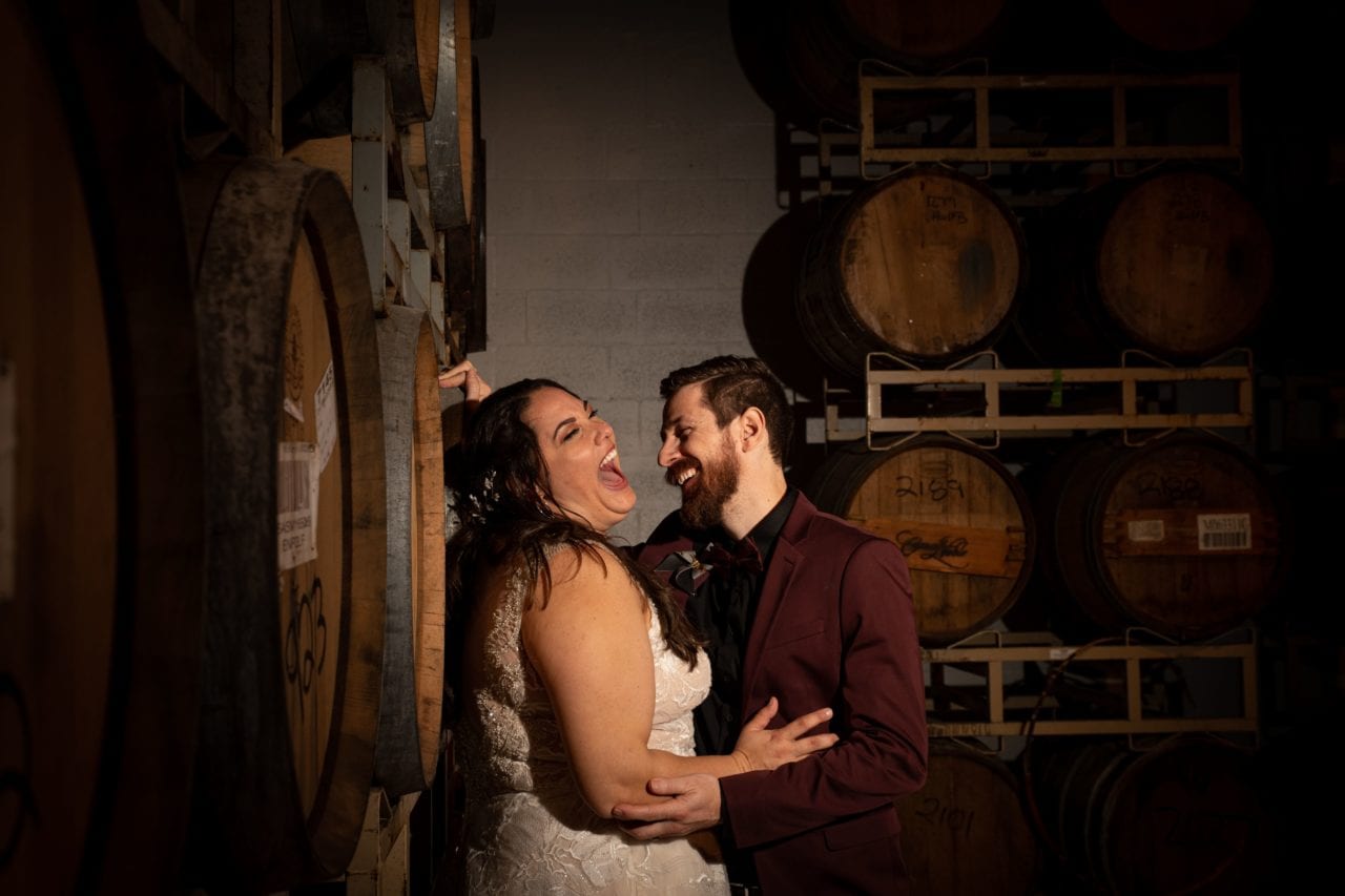 Bride and Groom laughing at Funky Buddha Brewery