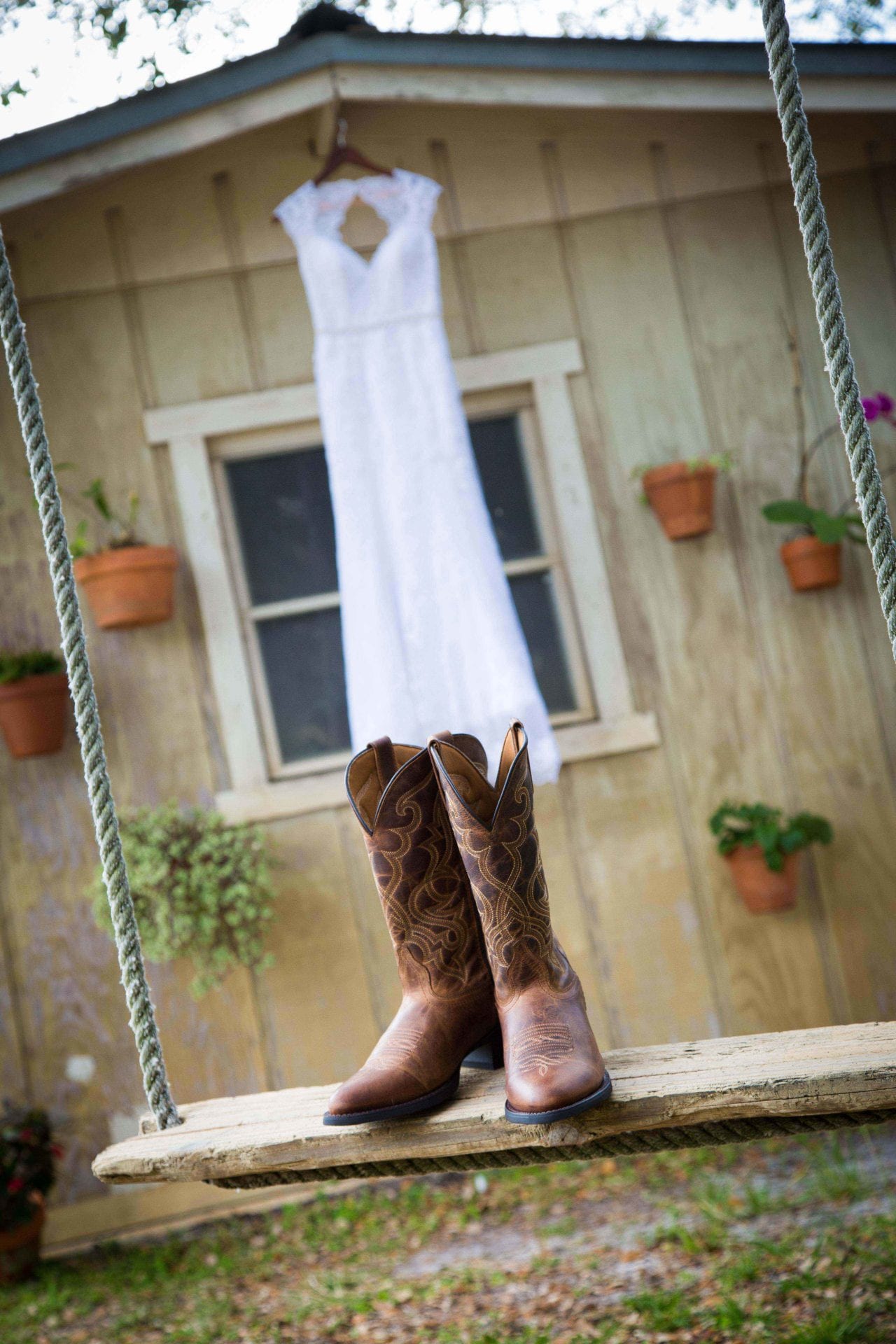 posing bride's gown with boots