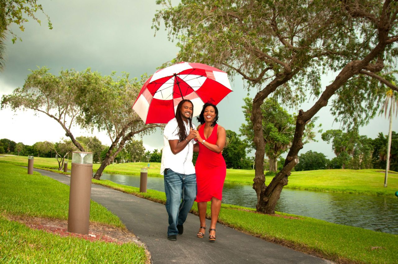 Engagement session photographer with unbrella