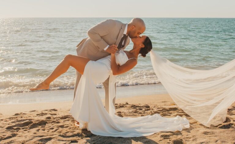 Fort Myers Wedding Photographer Summer Bride & Groom kissing on the beach