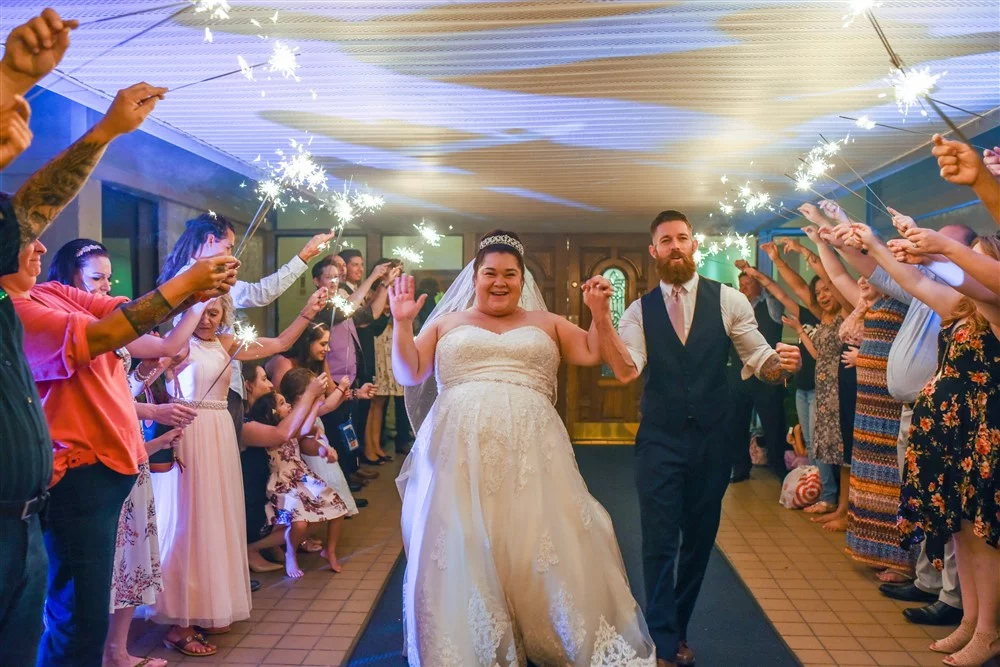 couple exiting aisle