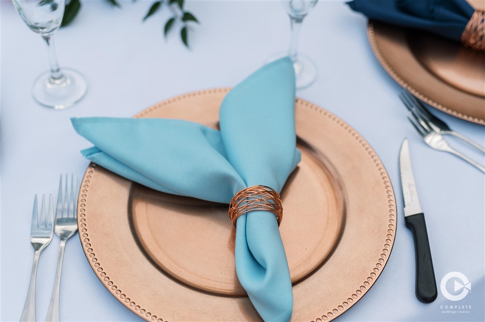 gold charter and blue napkins