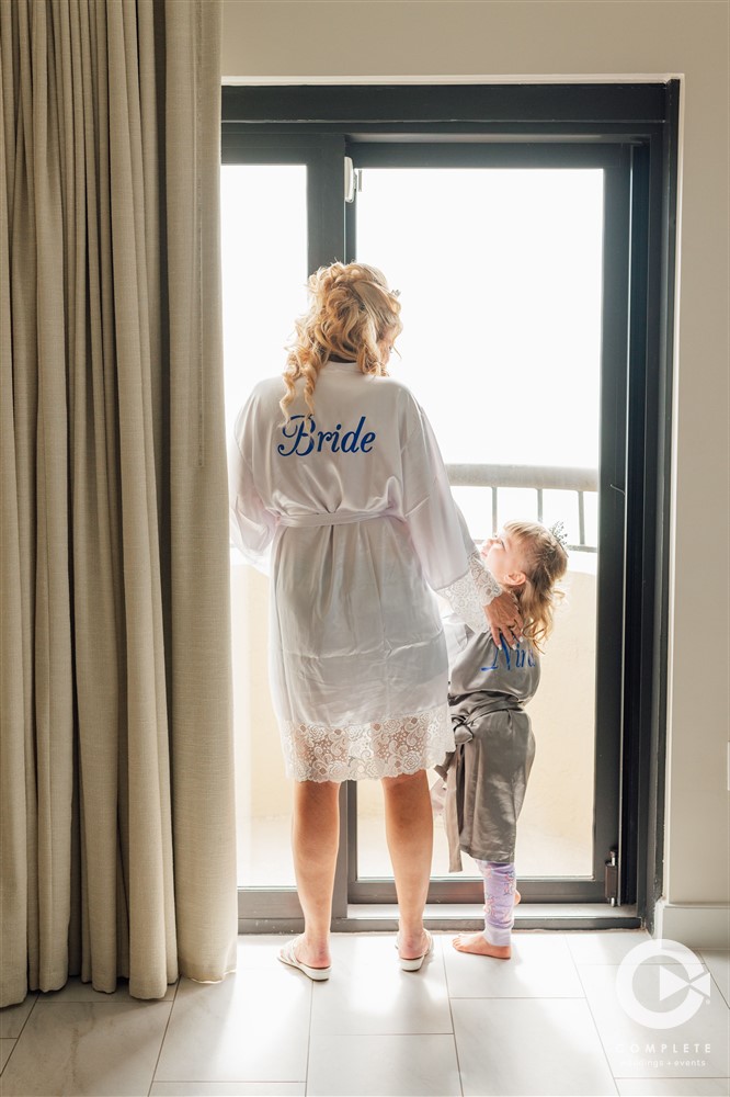 Bride and flower girl in the Hilton Marco Island bridal suite.