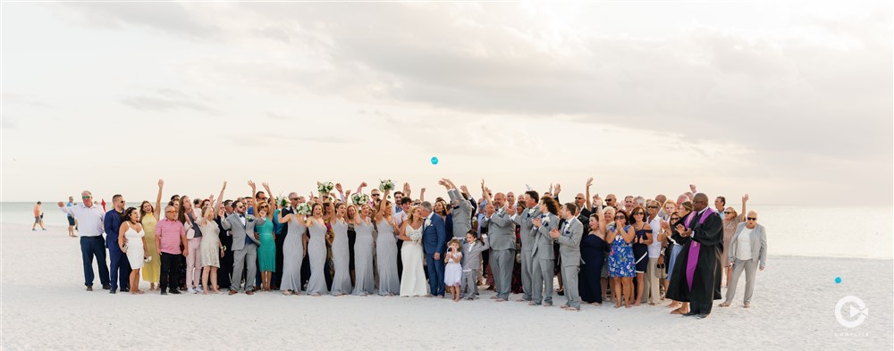 Epic wedding guest and wedding party beach wedding photos in front of Hilton Marco Island.