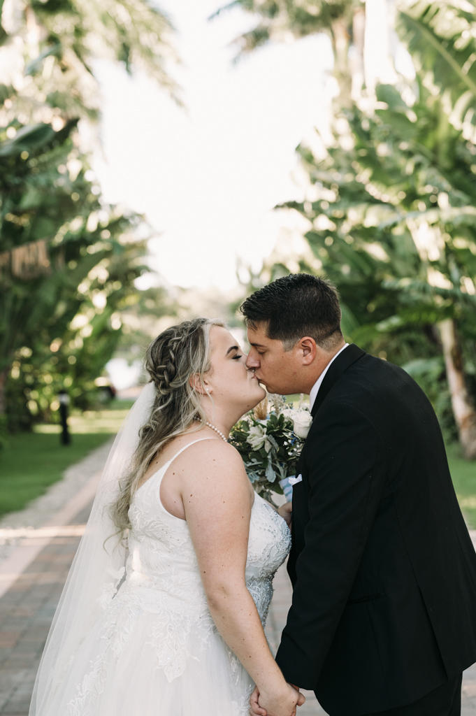 Haley and Nick's Ceremony Kiss at Grace River Island Resort Wedding Venue in Fort Myers