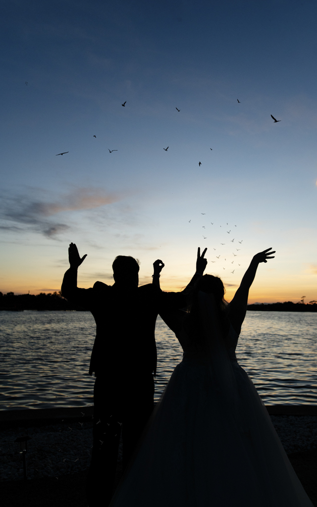 Haley and Nick Enjoying the Sunset after their Wedding at Grace River Island Resort Wedding Venue in Fort Myers