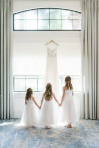 3 Flower girls in white dresses