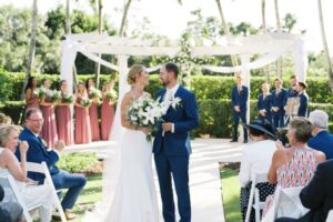 Newlyweds pose at Grandezza wedding immediately after the ceremony in Fort Myers