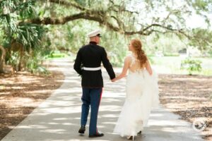 Newlywed Bride and Groom hold hands at the Verandah Club wedding venue in Fort Myers