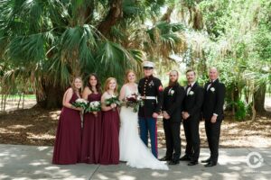 Newlywed Bride and Groom pose with the bridal party