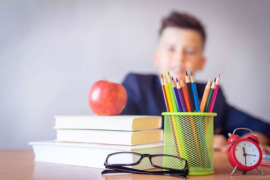 Photo of student looking at textbooks